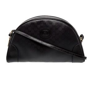 GUCCI *Vintage* Half-moon crossbody in black GG canvas with leather trim.